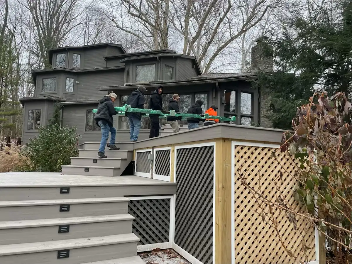 3 workers completing new patio by Riepenhoff Landscape