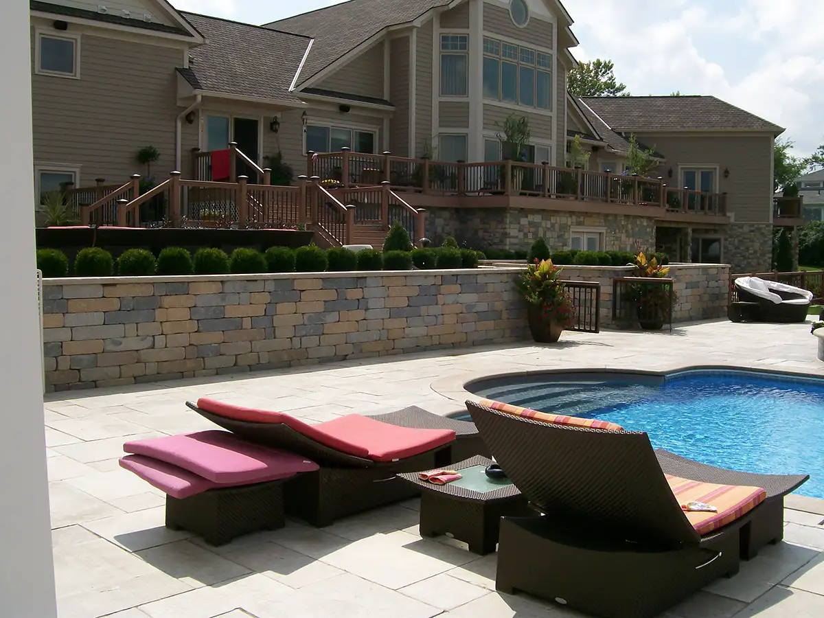 Homewood pool 1 stone pool surround and retaining wall by Riepenhoff Landscape