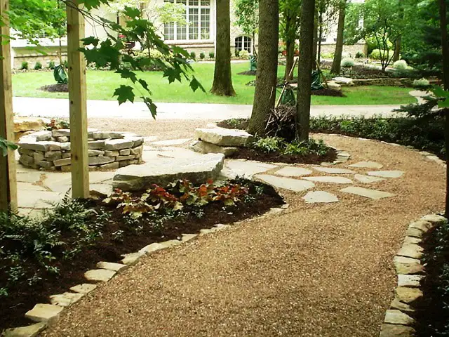 Mohr 2 pebble and stone pathway with firepit by Riepenhoff Landscape
