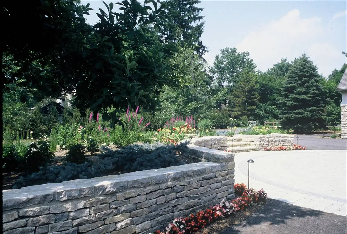 Picture8 stone patio and retaining wall with landscaping by Riepenhoff Landscape