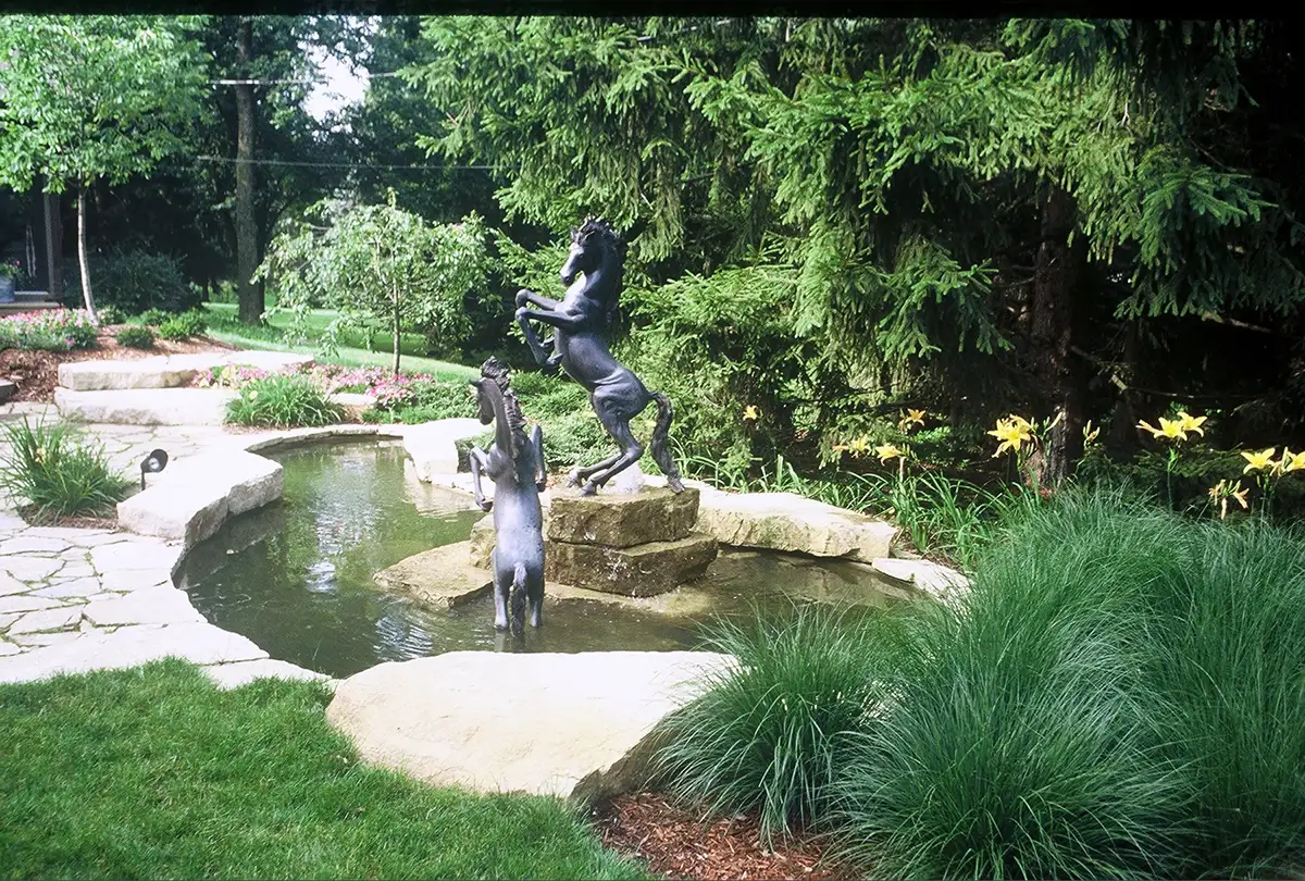 horse waterfeature landscaping with water feature by Riepenhoff Landscape